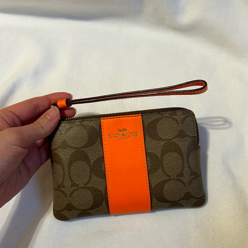 Neon orange coach wristlet